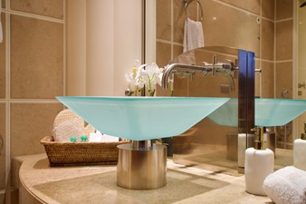 KIJO 33 One of the elegant glass vessel sinks and it's exquisite fixtures