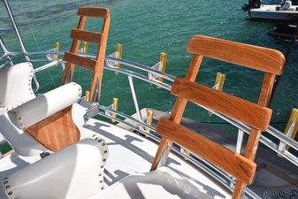 LOW BIDDER X  53 Teak ladderback helm chairs  