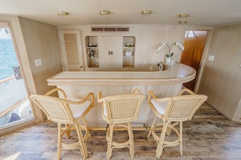 1984 Burger Raised Pilothouse 18 Bar with three bar stools
