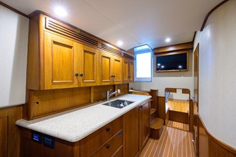 43' Jim Smith  24 Galley looking aft, TV mounted above  