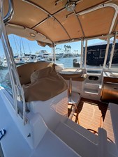 2022 Duffy 22 Cuddy Cabin 23 Cover helm station and movable teak table with cover