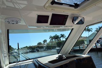 ERIKA RAY 12 Hardtop has integral stereo, lighting, vent hatch, Engine and Seakeeper screens above  