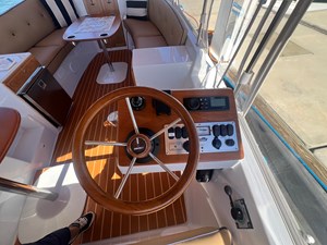 2022 Duffy 22 Cuddy Cabin 2 Helm Station - Your first mate can sit comfortably next to you.