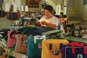 an image of a woman making bags at Albury's Sail Shop