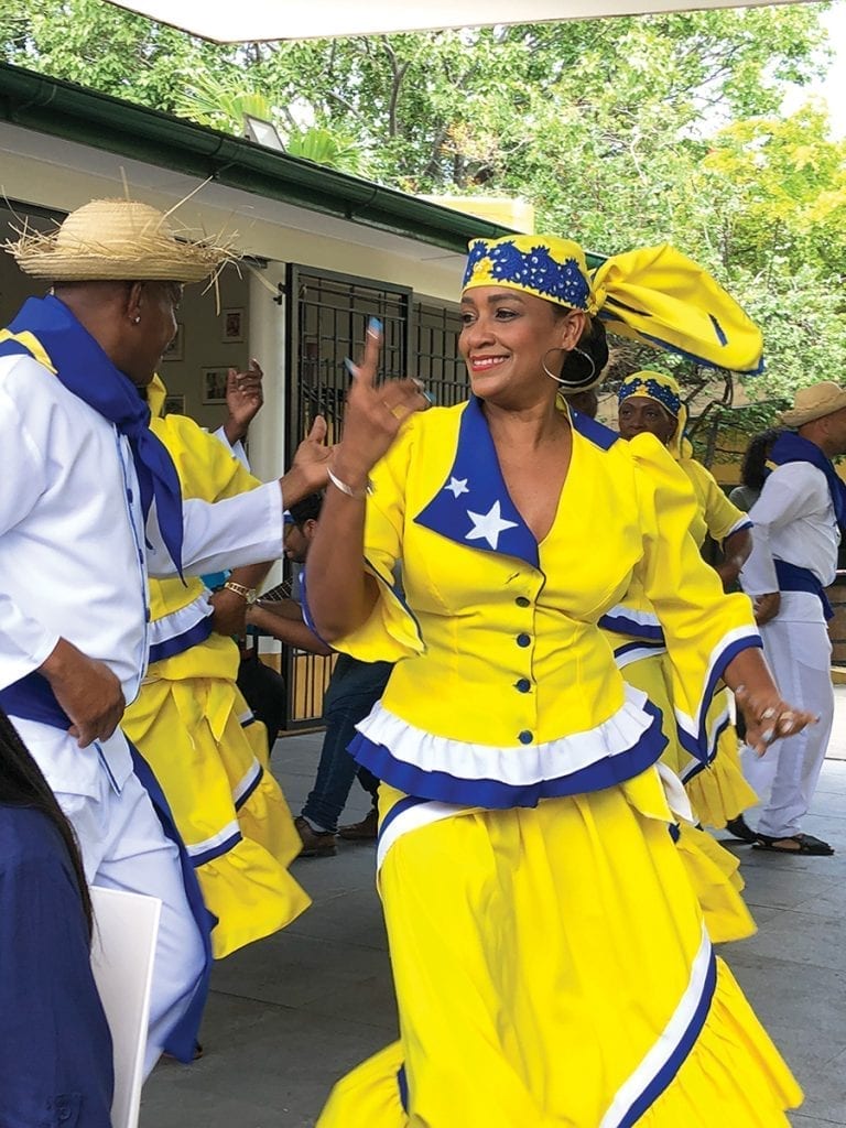 an image of woman in traditional outfit Curaçao