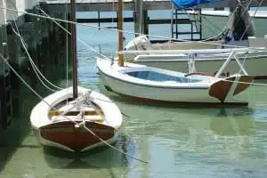 Dinghies tied to the dock at Abaco. Tips for Anchoring in the Bahamas.