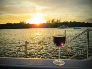 an image of a glass of wine on a boat in Man-O-War Cay