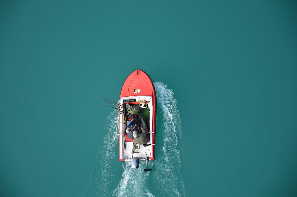 An image of a flats boat skimming the water
