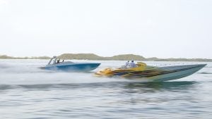An image of Two boats participate in the Annual Bahamas Poker Run.