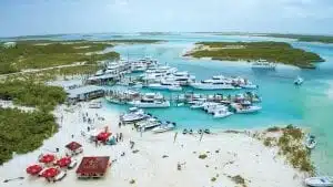 An images of boats on the beach and marina during an Annual Bahamas Poker Run