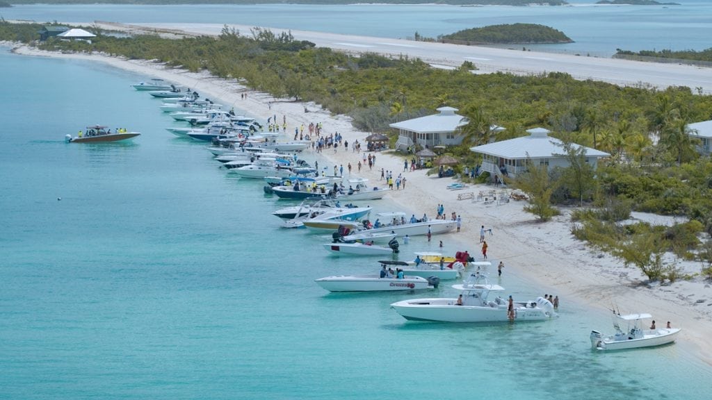An image of boats in the sand at The Annual Bahamas Poker Run