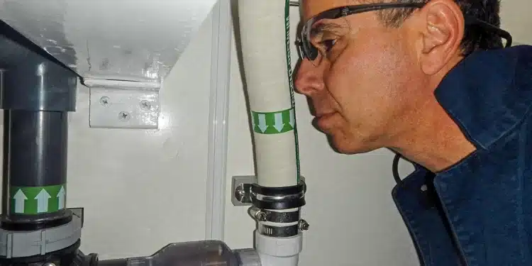 Man Sniffing Sanitation system pipe