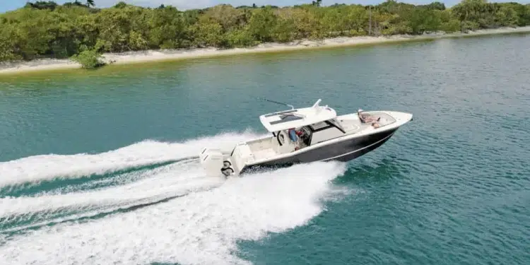 The Scout 377 lxf crossing along blue-green waters