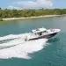 The Scout 377 lxf crossing along blue-green waters