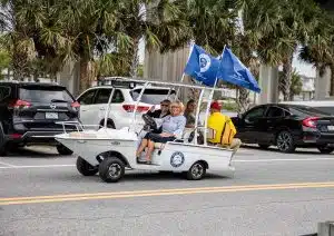 Captain Sandy driving passengers in the Freedom Boat Cart