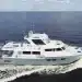 Side view of the Marlow 58E cruising in open waters