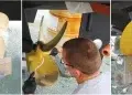 Man cleans and paints boat bottom