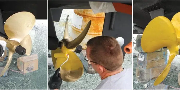 Man cleans and paints boat bottom