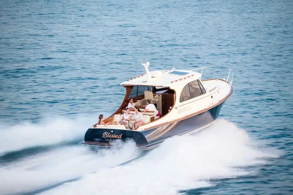 A family cruising and enjoying their picnic boat with Hinkley's silent jet propulsion system