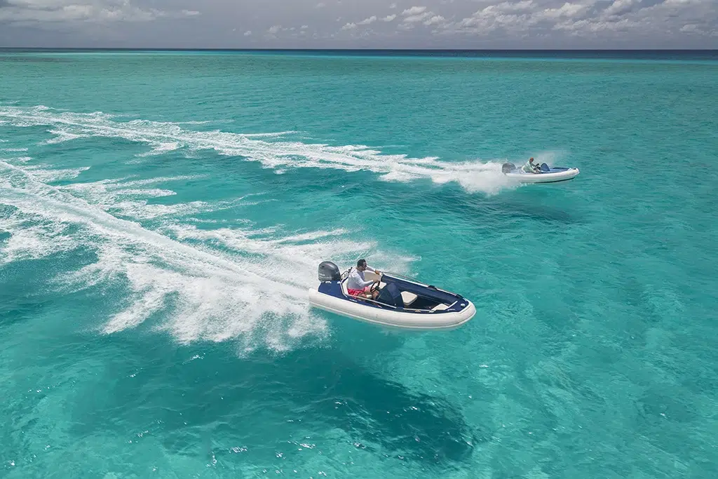 Two ArgosNautic RIBs crossing crystal clear waters.