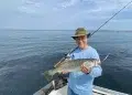 Man holding his Weakfish catch in Noyak Bay