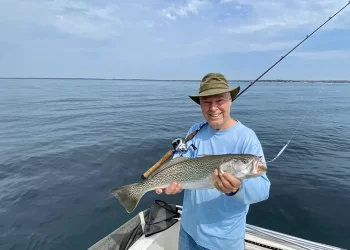 Man holding his Weakfish catch in Noyak Bay
