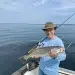 Man holding his Weakfish catch in Noyak Bay