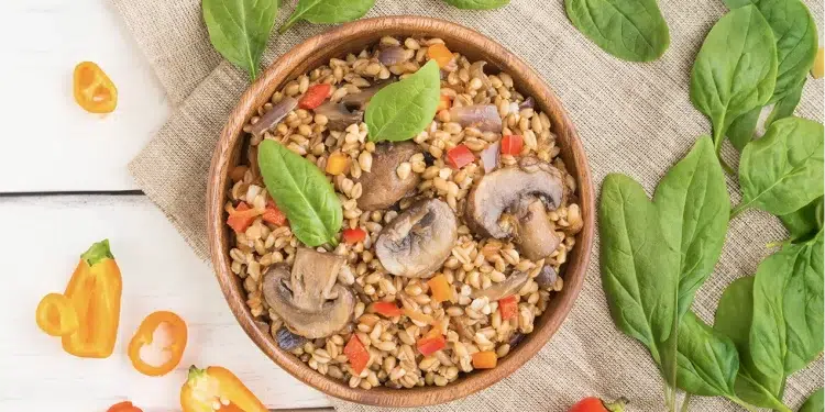 A bowl of food with mushrooms