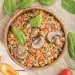 A bowl of food with mushrooms