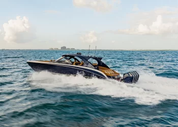 Mystic Powerboats' M5200 Boat Review Feature Image of the M5200 gliding across open water
