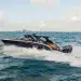 Mystic Powerboats' M5200 Boat Review Feature Image of the M5200 gliding across open water