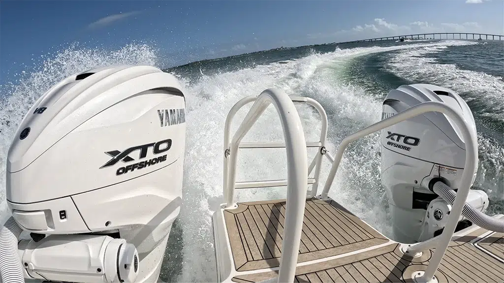 A close-up view of the Yamaha XTO 450 Offshore outboard while the boat cuts across open water