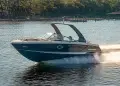 Chaparral SSX 267 slicing across deep blue waters with a treeline in the background