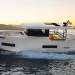 A De Antonie D50 turning on deep blue waters with a sunset in the background