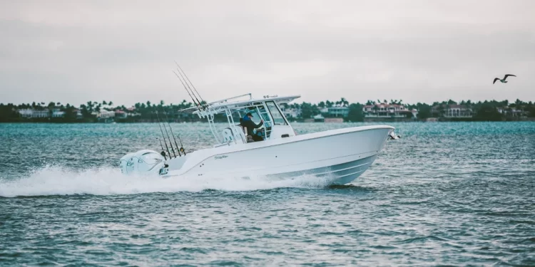 A side profile view of the EdgeWater 340cc gliding across water
