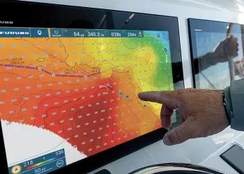 A Man points to a Furuno NavNet TZtouchXL MFDs screen