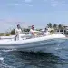 The people ride the Novurania across beach waters