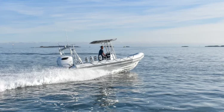 A RIBCRAFT skating across reflective blue waters