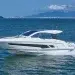 The Schaefer 375 jetting across blue waters with mountains in the background