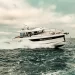 A starboard view of the Wellcraft 435 running across open waters