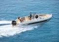 A couple crossing open water on a boat