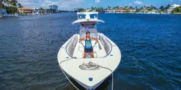 Woman using resistance bands for her boat fitness workout