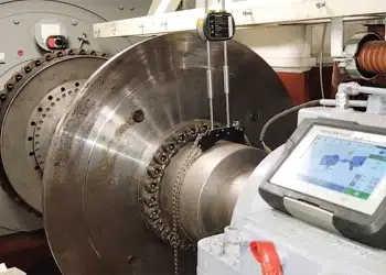 The inside of an engine room showing lasers checking shaft alignment for inboard engines