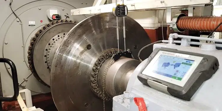 The inside of an engine room showing lasers checking shaft alignment for inboard engines