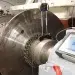 The inside of an engine room showing lasers checking shaft alignment for inboard engines