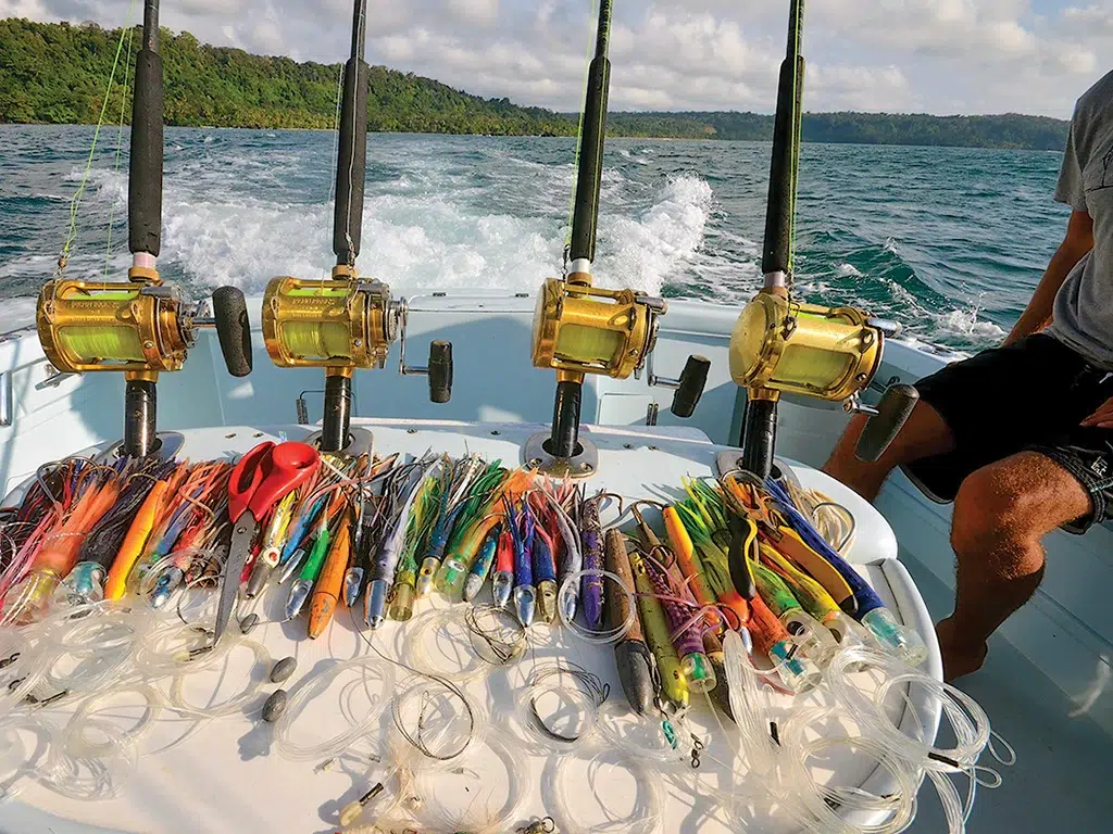 Rods and reels laid out on the transom of a fishing boat along costa rican waters