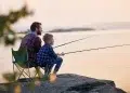 A father teaching a kid to fish