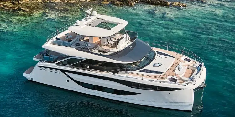 The Prestige M8 Power Catamaran anchored by a cove