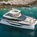 The Prestige M8 Power Catamaran anchored by a cove