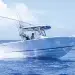 The Cobia 285CC running across near glass-like water